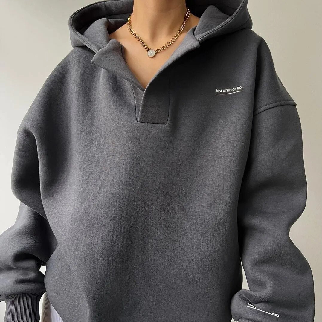 Oversized hoodie for women featuring a crossover hood, made from a soft cotton-polyester blend, perfect for casual lounge wear. 3
