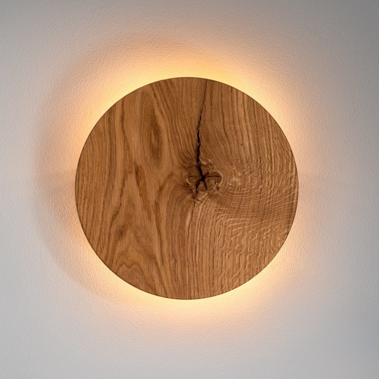 Round Oak Wall Light featuring Soft Indirect Lighting in a Minimalist Scandinavian Design, available in 22cm and 28cm diameter options. 7