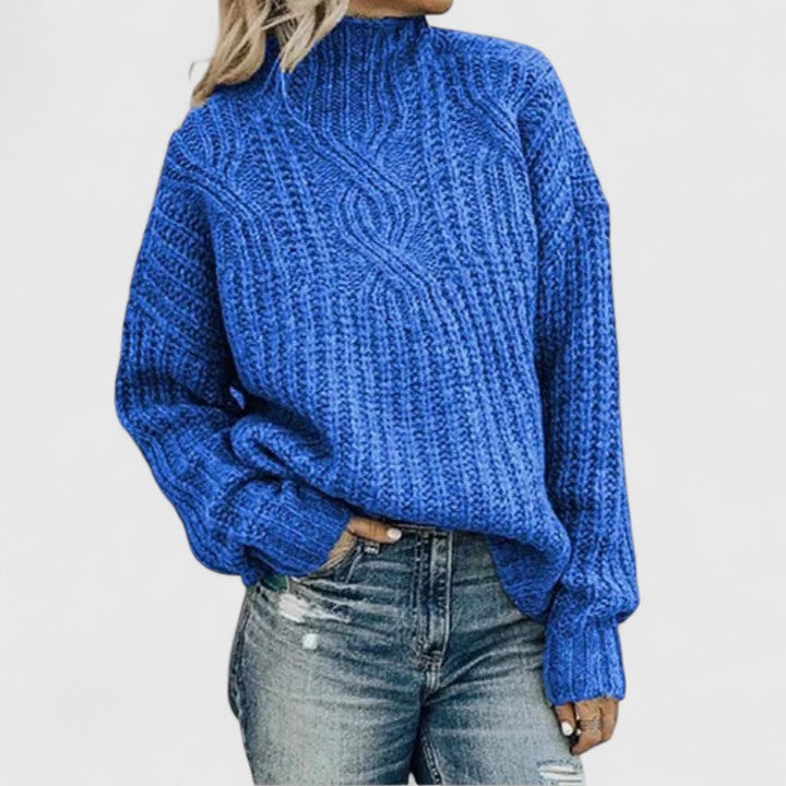 Women's cozy green sweater featuring a relaxed fit and classic cable knit design, perfect for transitional weather. 4