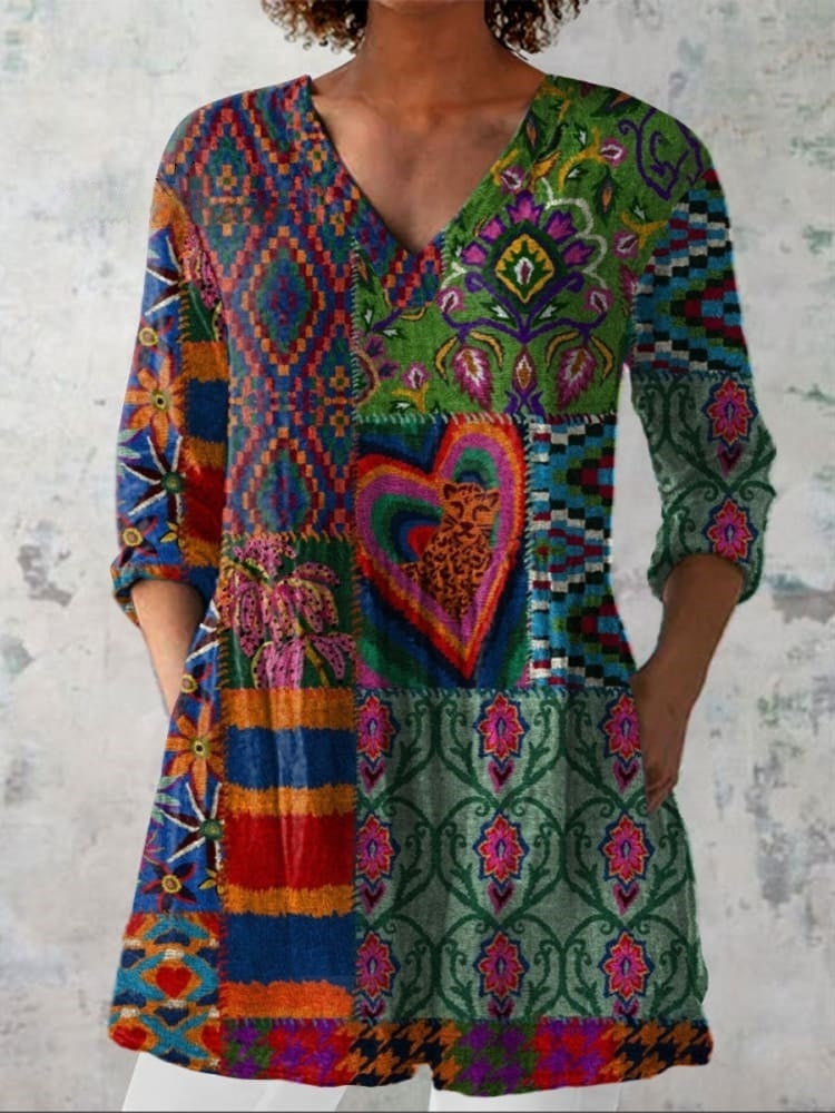 Womens boho floral V-neck shirt featuring soft drape and generously cut sleeves in warm earth tones 0