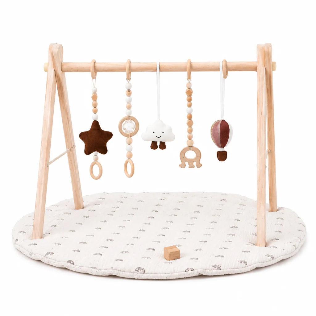 Wooden baby play gym featuring a natural wood frame and a colorful rainbow activity mat, designed for tummy time with detachable sensory toys for enhanced play and development 1