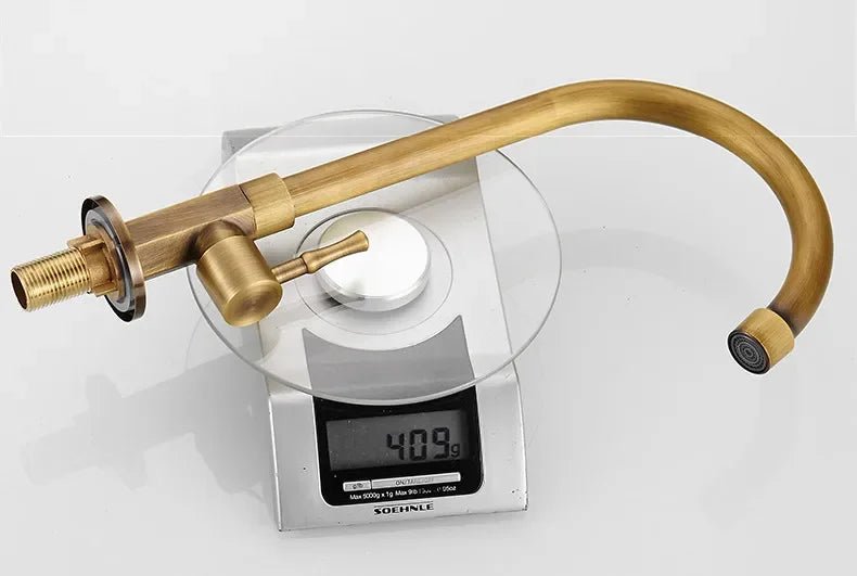 Antique brass kitchen faucet with swan neck spout and ceramic valve, showcasing an elegant design perfect for modern kitchens. 5