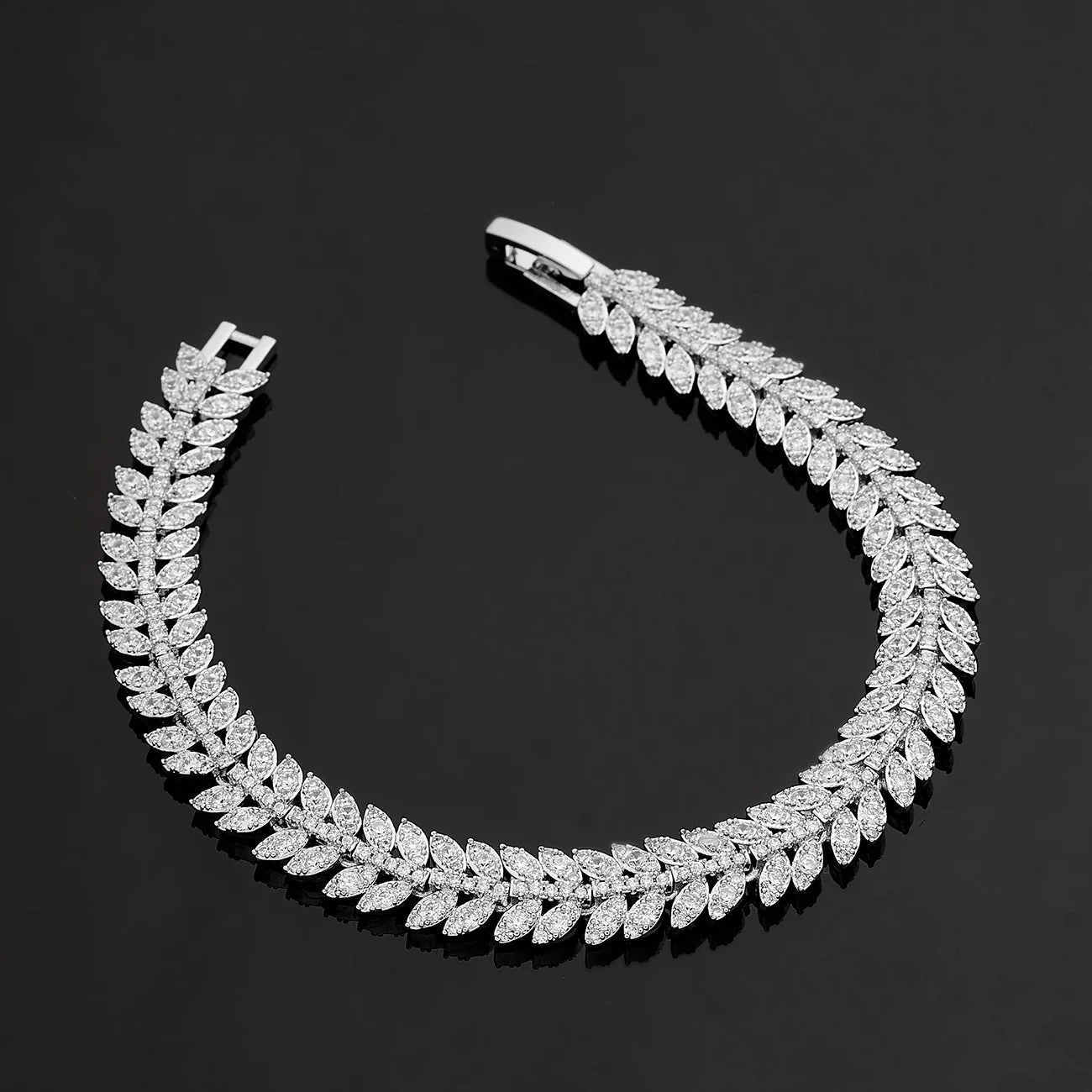 Bridal jewelry set featuring a stunning necklace, elegant earrings, a matching bracelet, and a beautiful ring, all in a 24K gold-plated 5