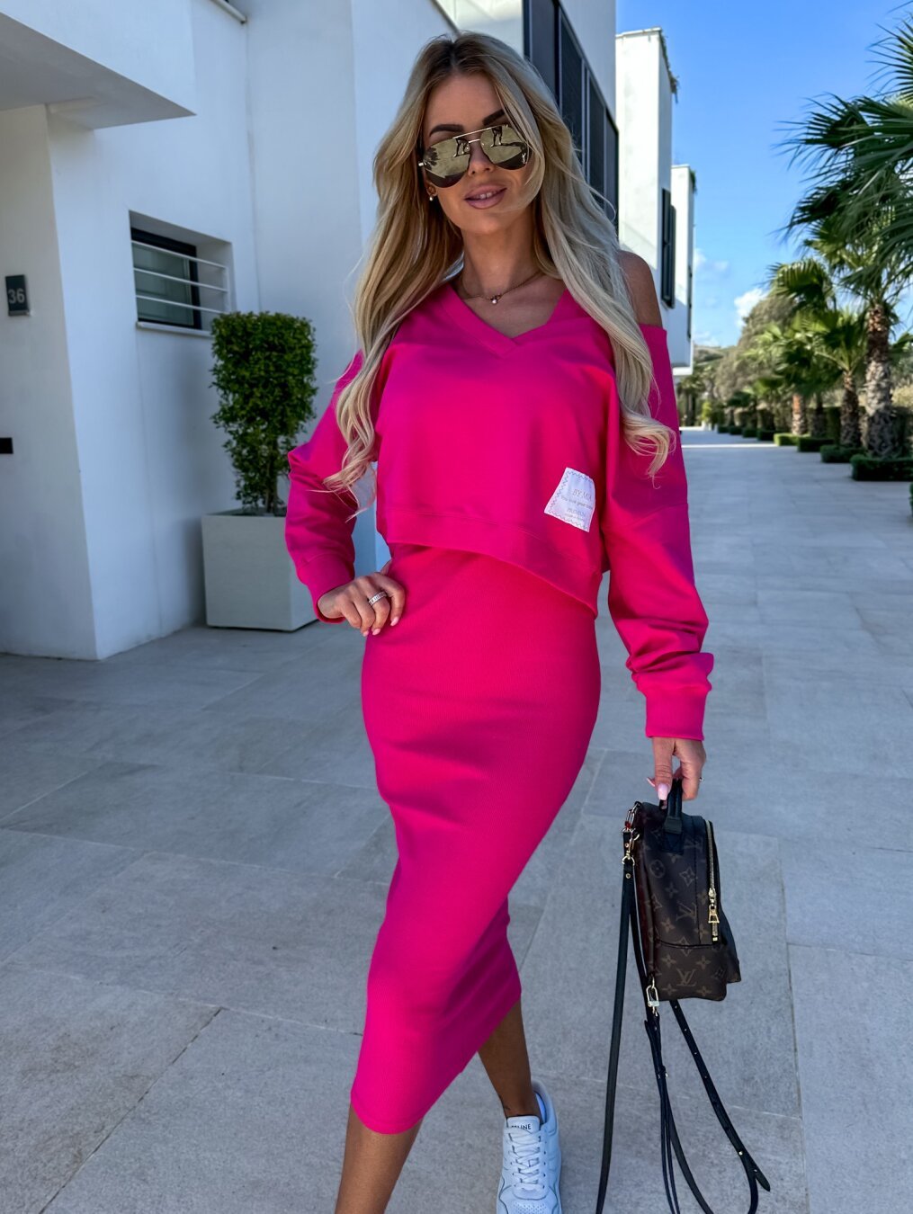 Chic two-piece set featuring a stylish midi dress paired with a comfortable sweatshirt, perfect for versatile women's fashion. 4
