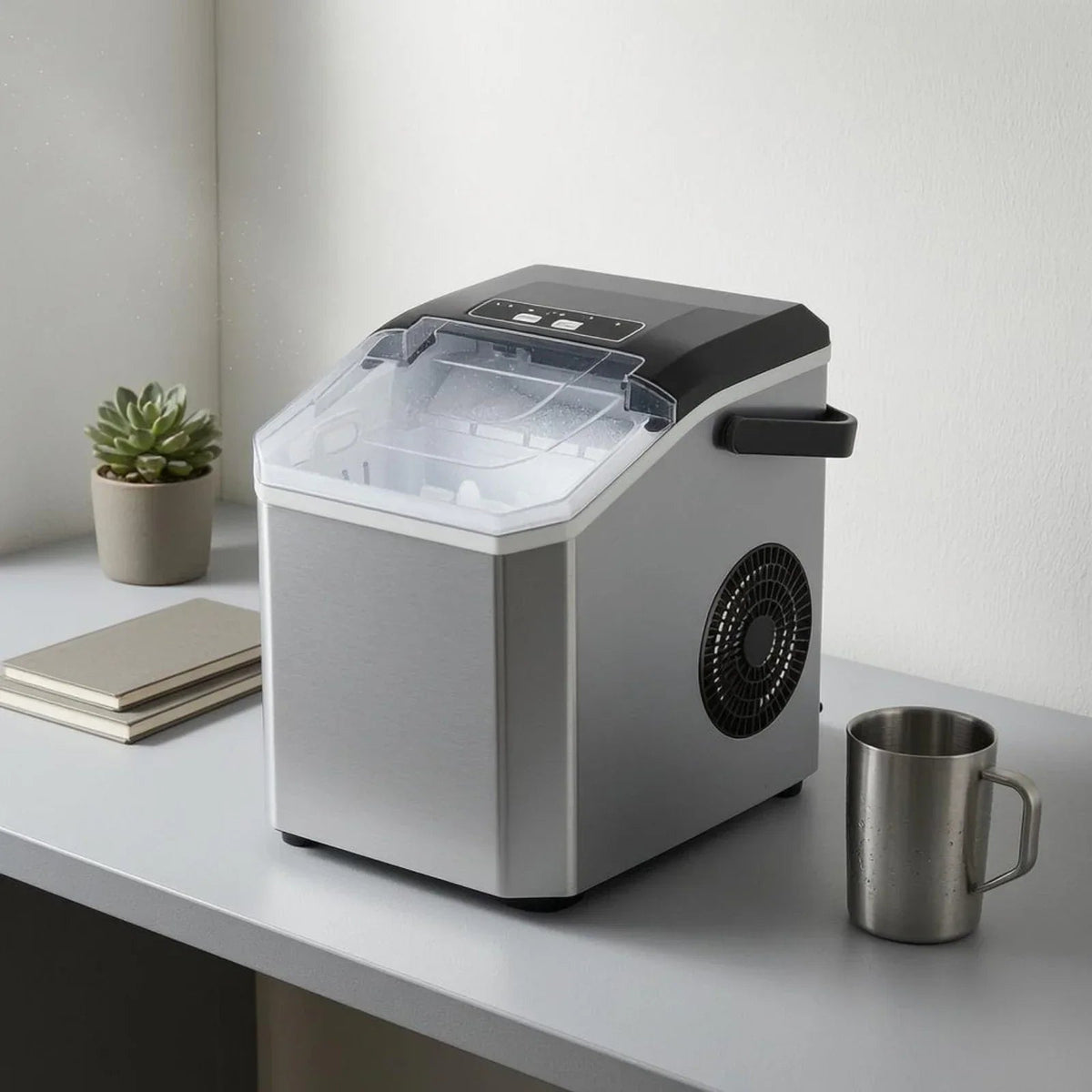 Compact Bullet Ice Maker with transparent lid, designed for home and office use, producing clear ice cubes efficiently on a sleek countertop. 8