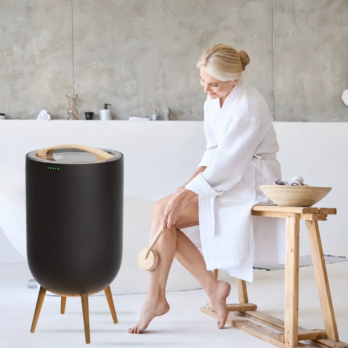 Freestanding towel warmer bucket in black and gold, featuring a Bluetooth speaker and LED ambient light, with a 23L capacity for cozy towels. 1