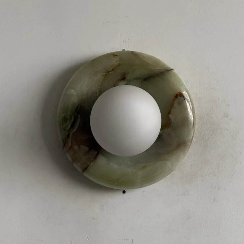 Globe Wall Light featuring a natural onyx backplate, designed as a compact ambient sconce for modern interior decor. 35