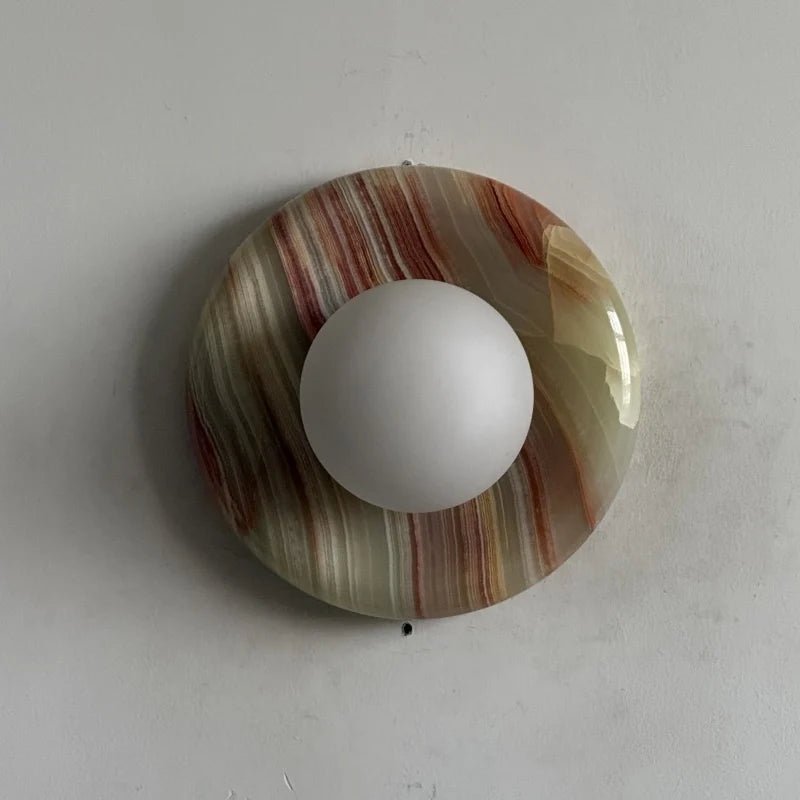Globe Wall Light featuring a natural onyx backplate, designed as a compact ambient sconce for modern interior decor. 0