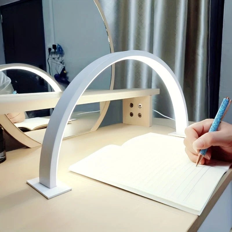 LED desk lamp featuring an adjustable brightness and color temperature, designed with a sleek metal arch, USB powered for convenience. 0