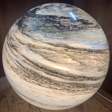 LED table lamp featuring a unique swirl pattern and soft glow, designed with an elegant glass-look finish, perfect for bedside or desk use. 6
