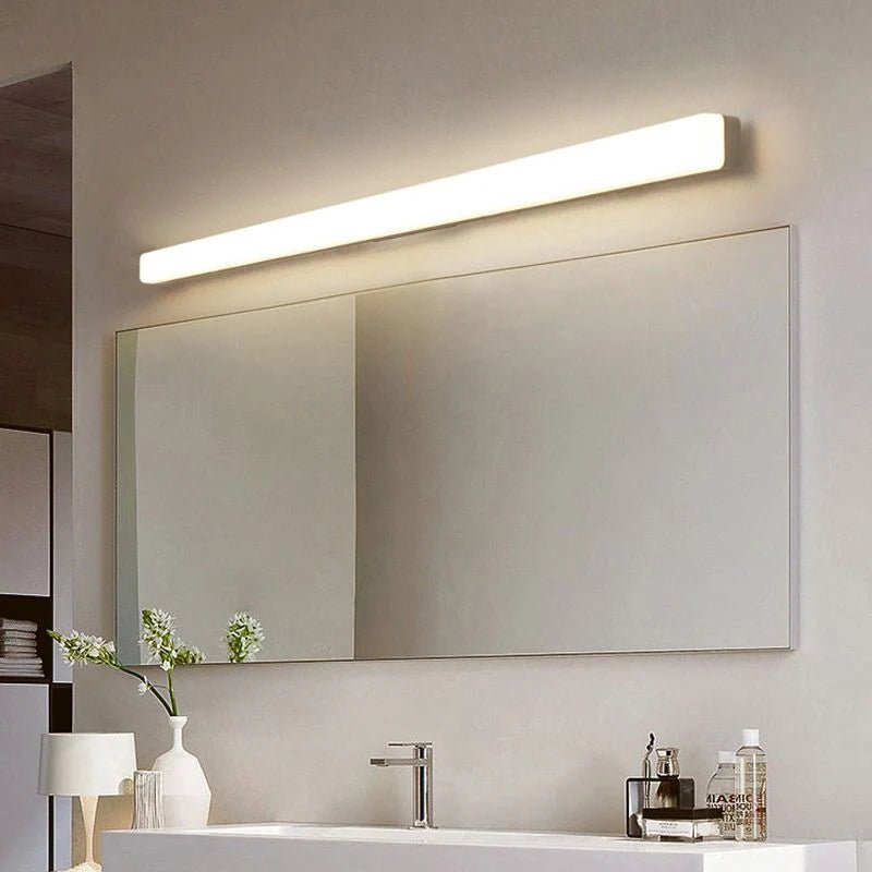 Linear wall light featuring an acrylic diffuser, designed for bathroom use, IP44 rated for moisture resistance, offering soft illumination in a sleek white finish. 0