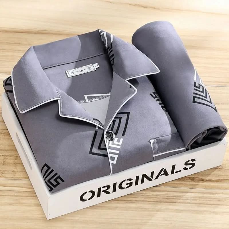 Men's pajama set featuring a button-down shirt and matching pants, designed for year-round comfort with soft, breathable fabric, ideal for restful sleep. 10