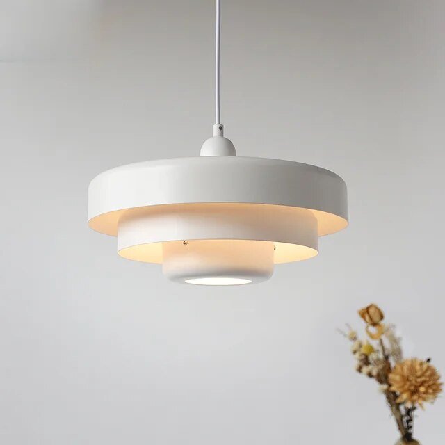 Modern pendant light featuring a Scandinavian minimalist design, adjustable height, perfect for illuminating kitchen islands and dining areas. 6
