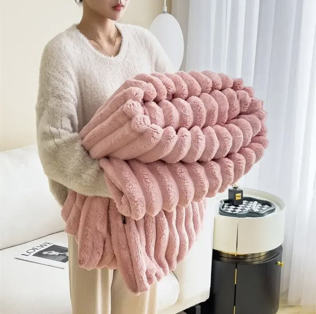 Soft faux fur blanket in a cozy living room setting, showcasing its lightweight design and luxurious texture, perfect for home decor and easy washing. 4