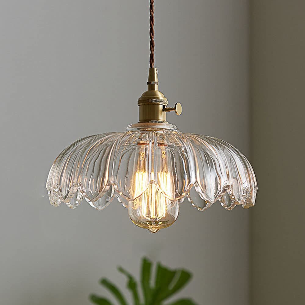 Vintage glass pendant light with a stylish copper finish, designed to provide soft ambient illumination for kitchen islands, enhancing rustic and modern decor. 11