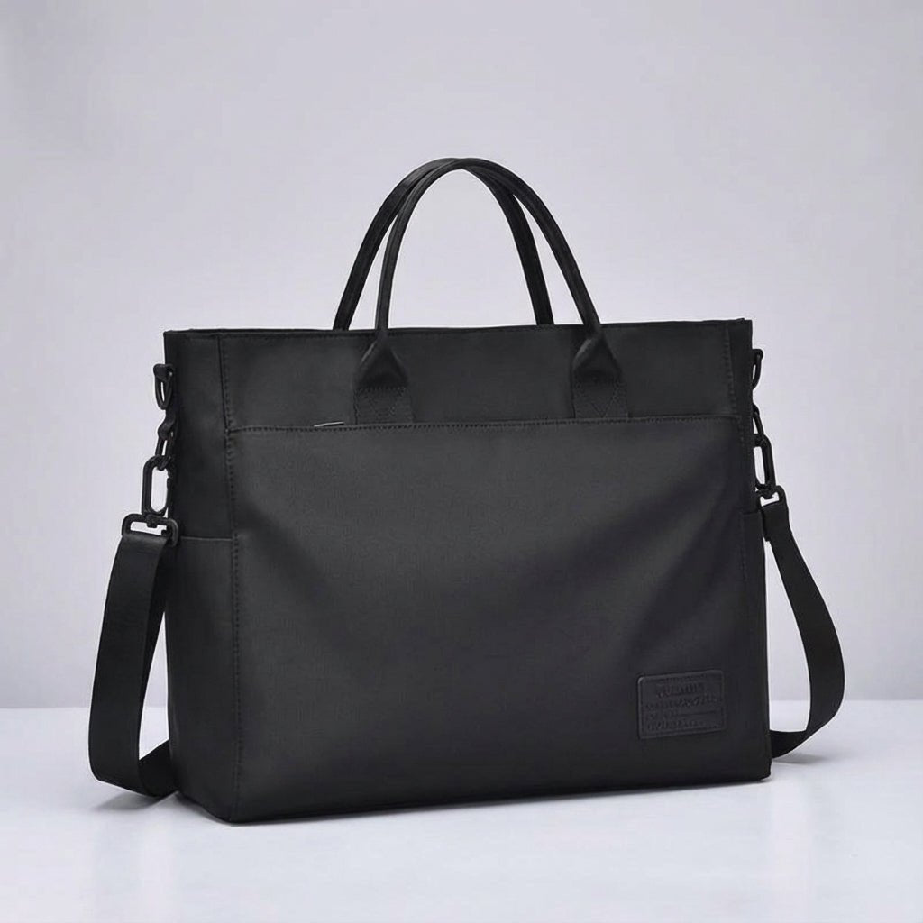 Water-repellent laptop bag featuring an adjustable strap, designed for casual business use with multiple compartments for organization. 3