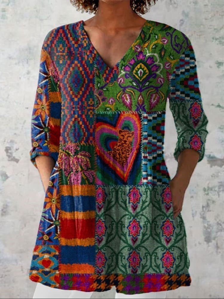 Womens boho floral V-neck shirt featuring soft drape and generously cut sleeves in warm earth tones 0