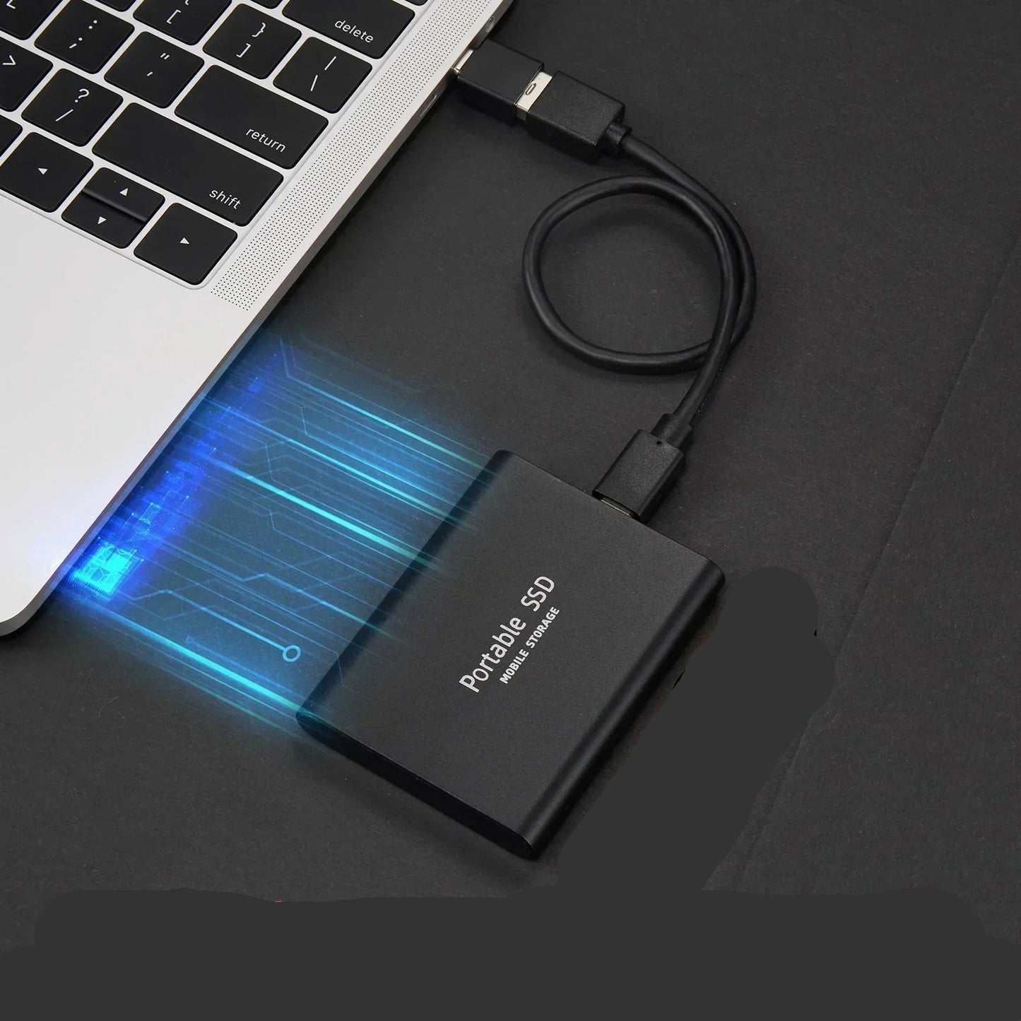128TB Portable SSD External Hard Drive in sleek aluminum design, showcasing ultra-fast data transfer speeds and compact size, perfect for on-the-go storage solutions. 1