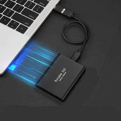 128TB Portable SSD External Hard Drive in sleek aluminum design, showcasing ultra-fast data transfer speeds and compact size, perfect for on-the-go storage solutions. 1