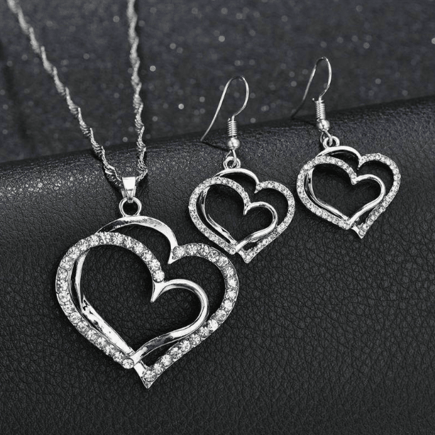 925 Sterling Silver Jewelry Set featuring a Double Heart Design, includes a matching necklace, earrings, and an adjustable bracelet. 1