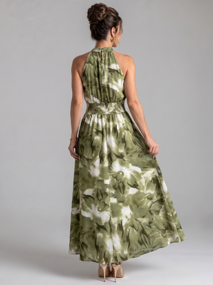 Abstract print midi dress featuring a halter neckline and defined waist, designed with lightweight, flowing fabric for a comfortable and stylish look. 3