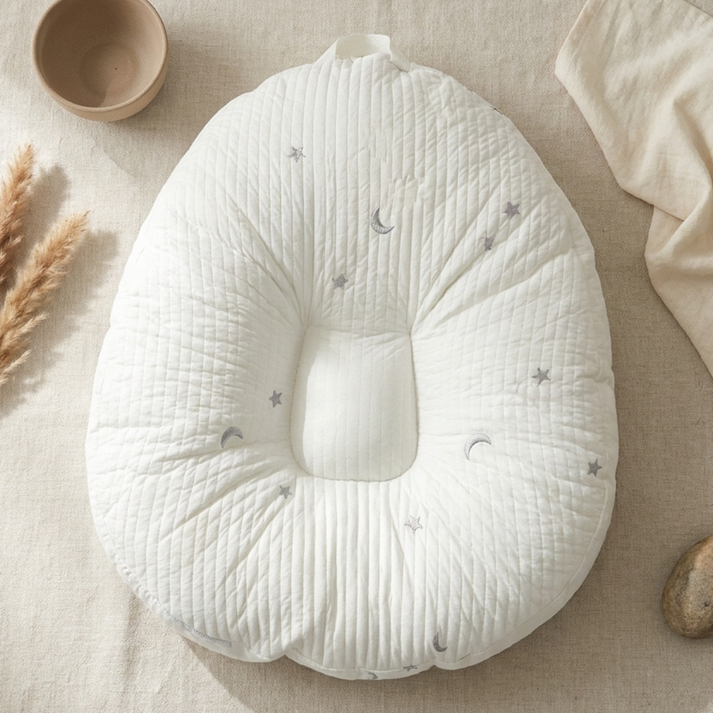 Baby lounger featuring ergonomic support, made with breathable cotton fabric, designed in a soft nest shape for optimal comfort and safety for infants. 7
