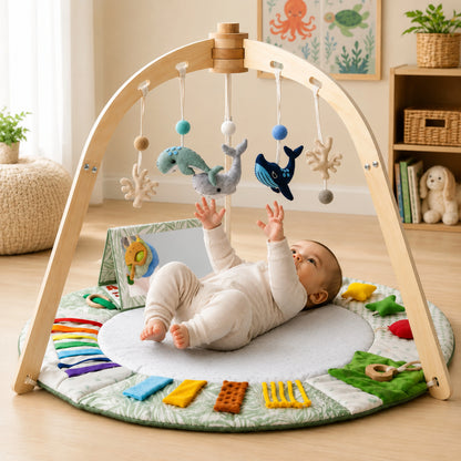 Baby play gym featuring a sensory activity mat and natural wooden frame, designed in a vibrant multi-color scheme for tummy time and exploration. 0