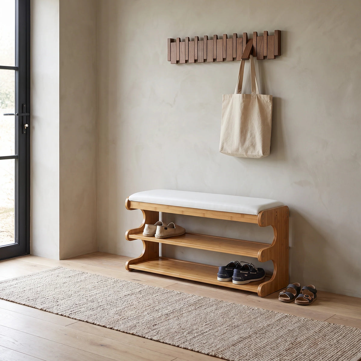 Bamboo shoe storage bench with padded seat in natural finish, featuring a space-saving design ideal for entryway organization. 2