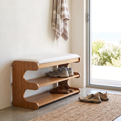 Bamboo shoe storage bench with padded seat in natural finish, featuring a space-saving design ideal for entryway organization. 3