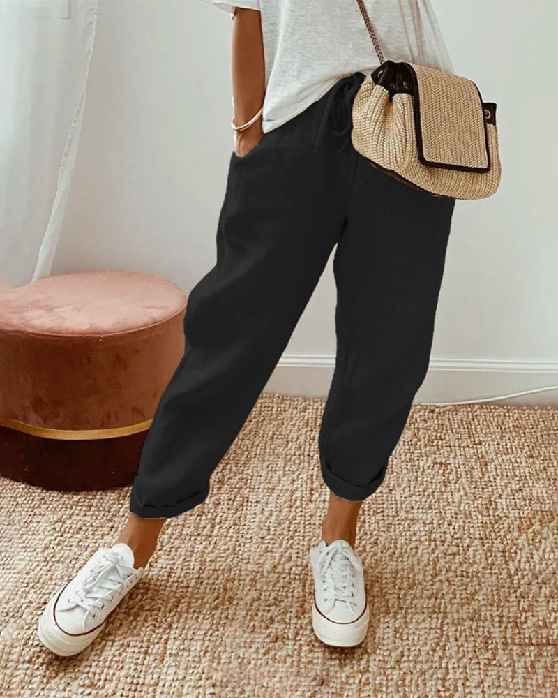 Breathable high-waist pants featuring a flowing silhouette and smooth finish, crafted from lightweight fabric for ultimate comfort and versatility. 2