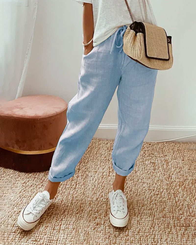 Breathable high-waist pants featuring a flowing silhouette and smooth finish, crafted from lightweight fabric for ultimate comfort and versatility. 3