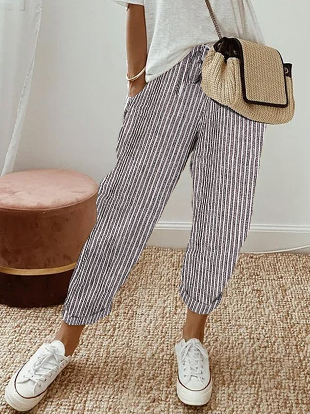 Breathable high-waist pants featuring a flowing silhouette and smooth finish, crafted from lightweight fabric for ultimate comfort and versatility. 6