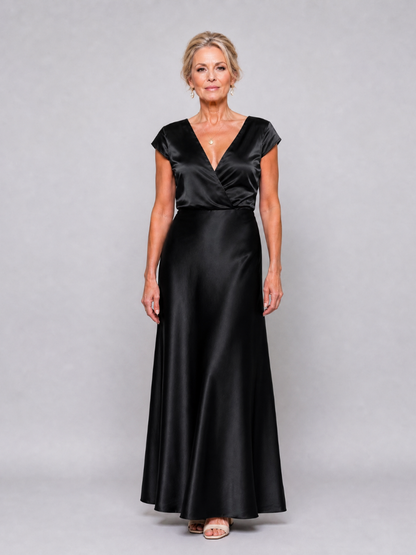 Elegant white cap sleeve maxi dress featuring a wrap bodice and flattering V neckline, perfect for formal occasions and summer events. 9