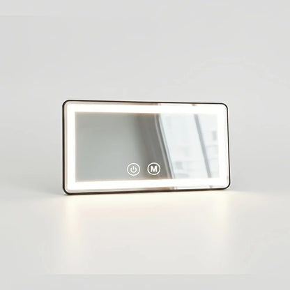 Car visor mirror with dimmable LED lighting, adjustable makeup mirror for on-the-go grooming, featuring a sleek black plastic and glass design. 2