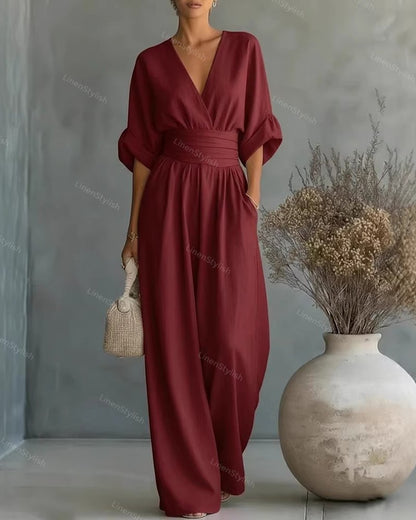 Casual V-Neck Jumpsuit for Women featuring a flattering waistline, made from soft and comfortable fabric, available in black and white options. 1
