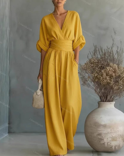 Casual V-Neck Jumpsuit for Women featuring a flattering waistline, made from soft and comfortable fabric, available in black and white options. 9