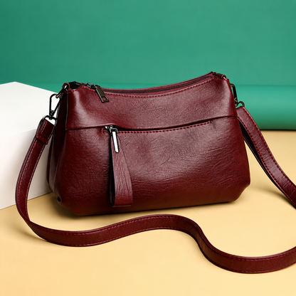 Lightweight crossbody bag for women featuring smart compartments and an adjustable strap, perfect for everyday use. 1