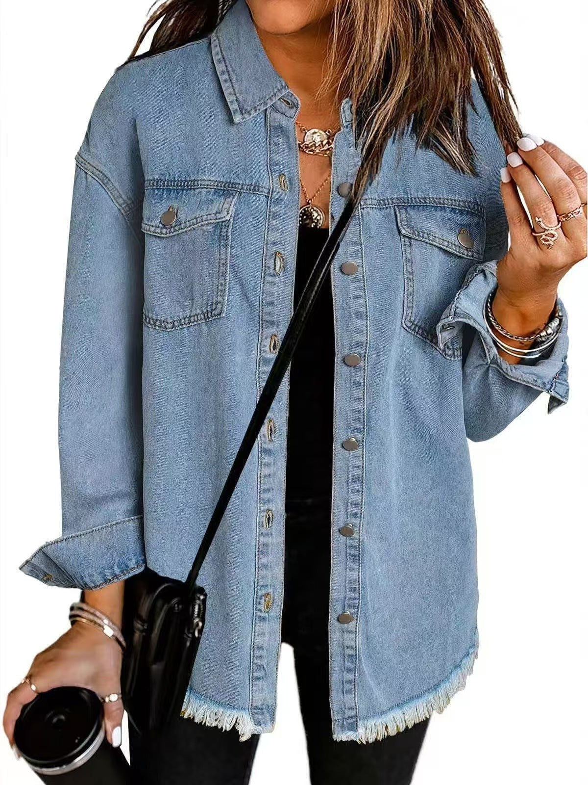 Classic blue oversized denim jacket for women featuring a relaxed fit and functional pockets, perfect for casual outings and layering. 1