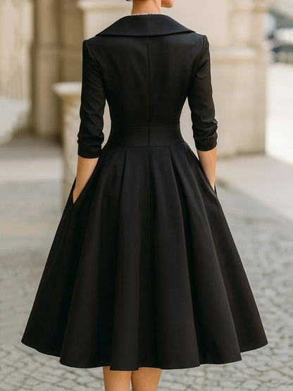 Elegant midi dress featuring a flattering V-neckline and a defined waist, perfect for formal occasions. 1