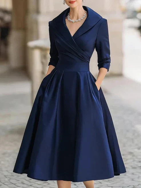 Elegant midi dress featuring a flattering V-neckline and a defined waist, perfect for formal occasions. 2