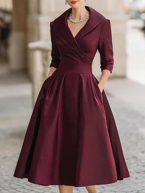 Elegant midi dress featuring a flattering V-neckline and a defined waist, perfect for formal occasions. 3