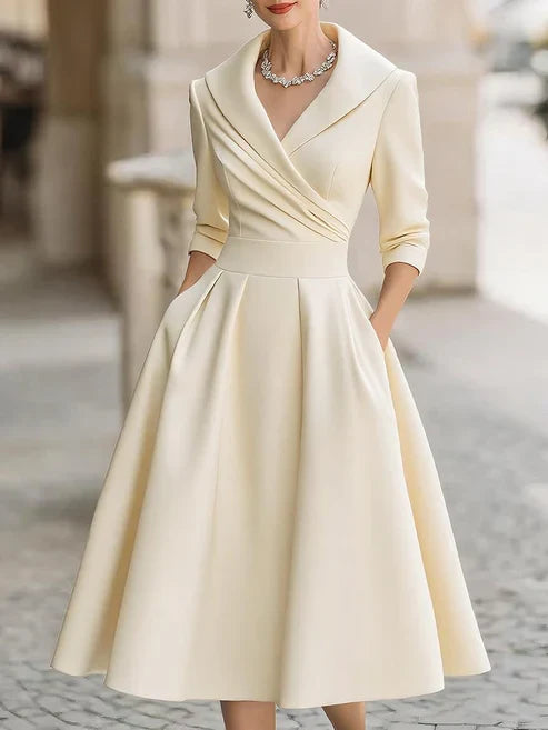 Elegant midi dress featuring a flattering V-neckline and a defined waist, perfect for formal occasions. 4