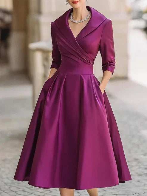 Elegant midi dress featuring a flattering V-neckline and a defined waist, perfect for formal occasions. 5