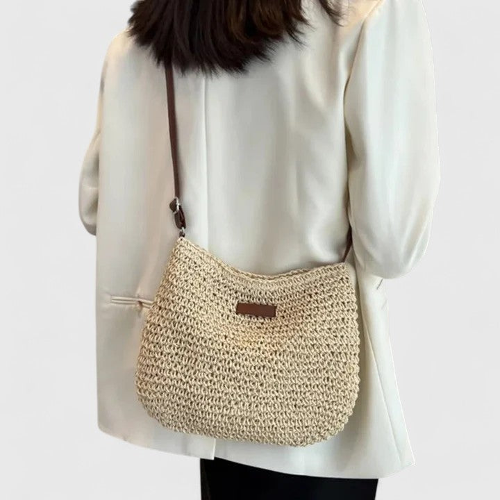 Elegant slouchy bag featuring an adjustable strap and secure zipper closure, perfect for stylish everyday use. 0