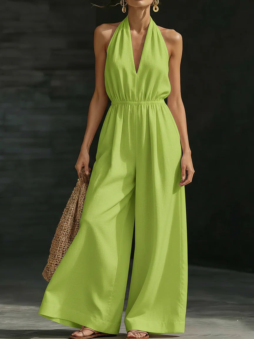 Elegant wide-leg jumpsuit featuring a lace overlay and adjustable halter tie, designed for women in soft, breathable fabric. 3