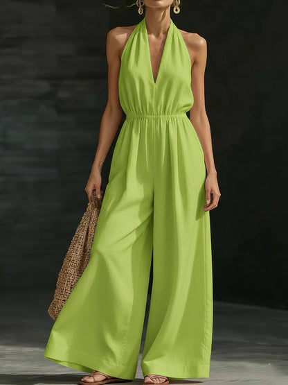 Elegant wide-leg jumpsuit featuring a lace overlay and adjustable halter tie, designed for women in soft, breathable fabric. 3