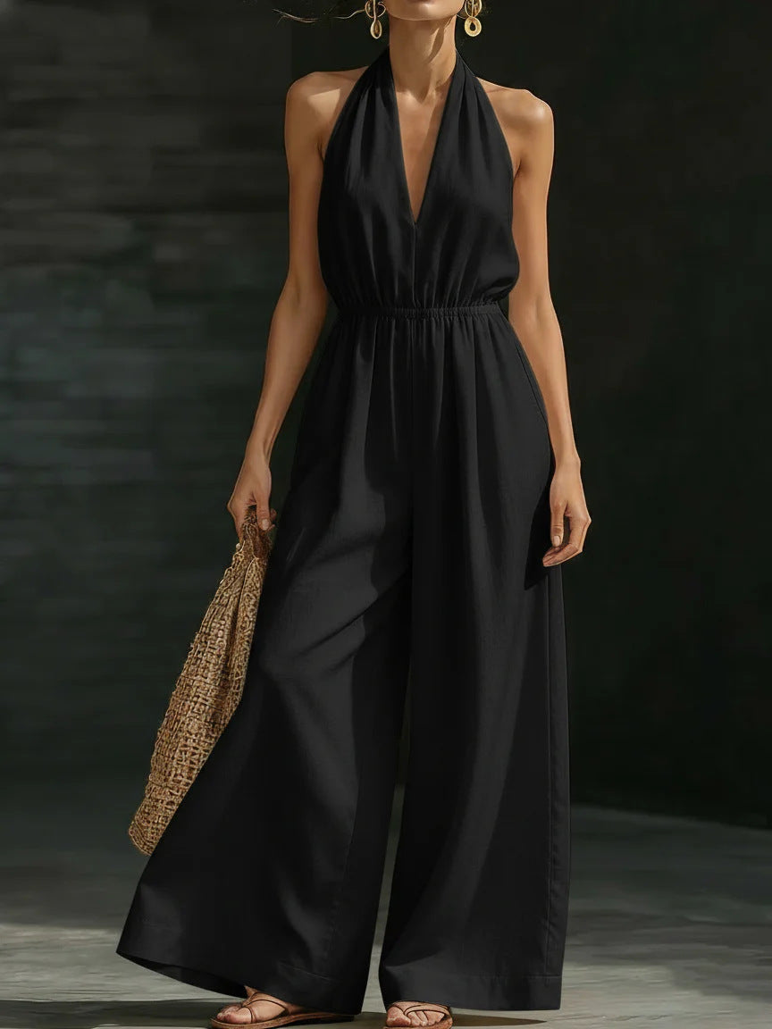 Elegant wide-leg jumpsuit featuring a lace overlay and adjustable halter tie, designed for women in soft, breathable fabric. 4