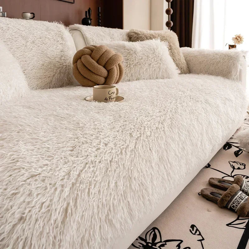Faux lambswool sofa cover with a stretchable fit, designed to provide cozy protection for various sofa sizes, enhancing comfort and style in any living 0