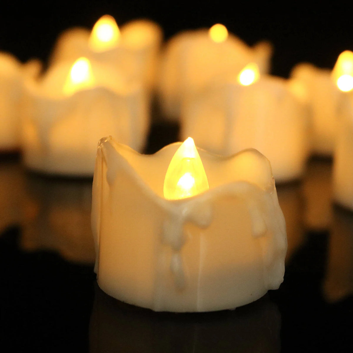 Flameless LED taper candle set in warm white light, 12 pack, perfect for elegant home decor, providing a safe and stylish ambiance. 2
