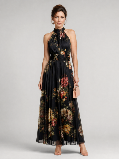 Floral midi dress featuring a defined waist and halter neck, designed for summer weddings, made from lightweight, flowing fabric. 0